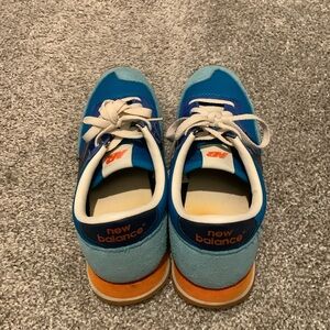 New Balance in blue/tealblue/orange color